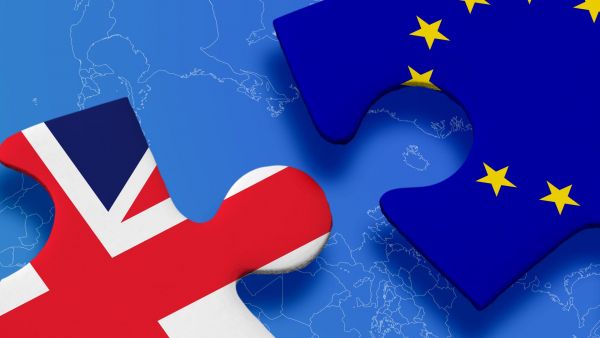 Image of two puzzle pieces branded with UK and EU flags
