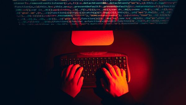hacker spyware hands computer keyboard