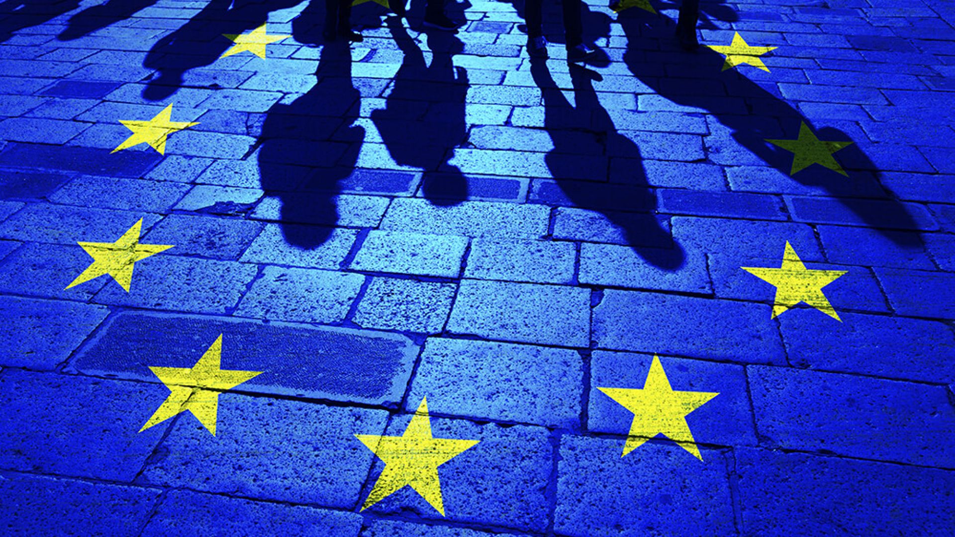 Silhouette of people in EU flag stars
