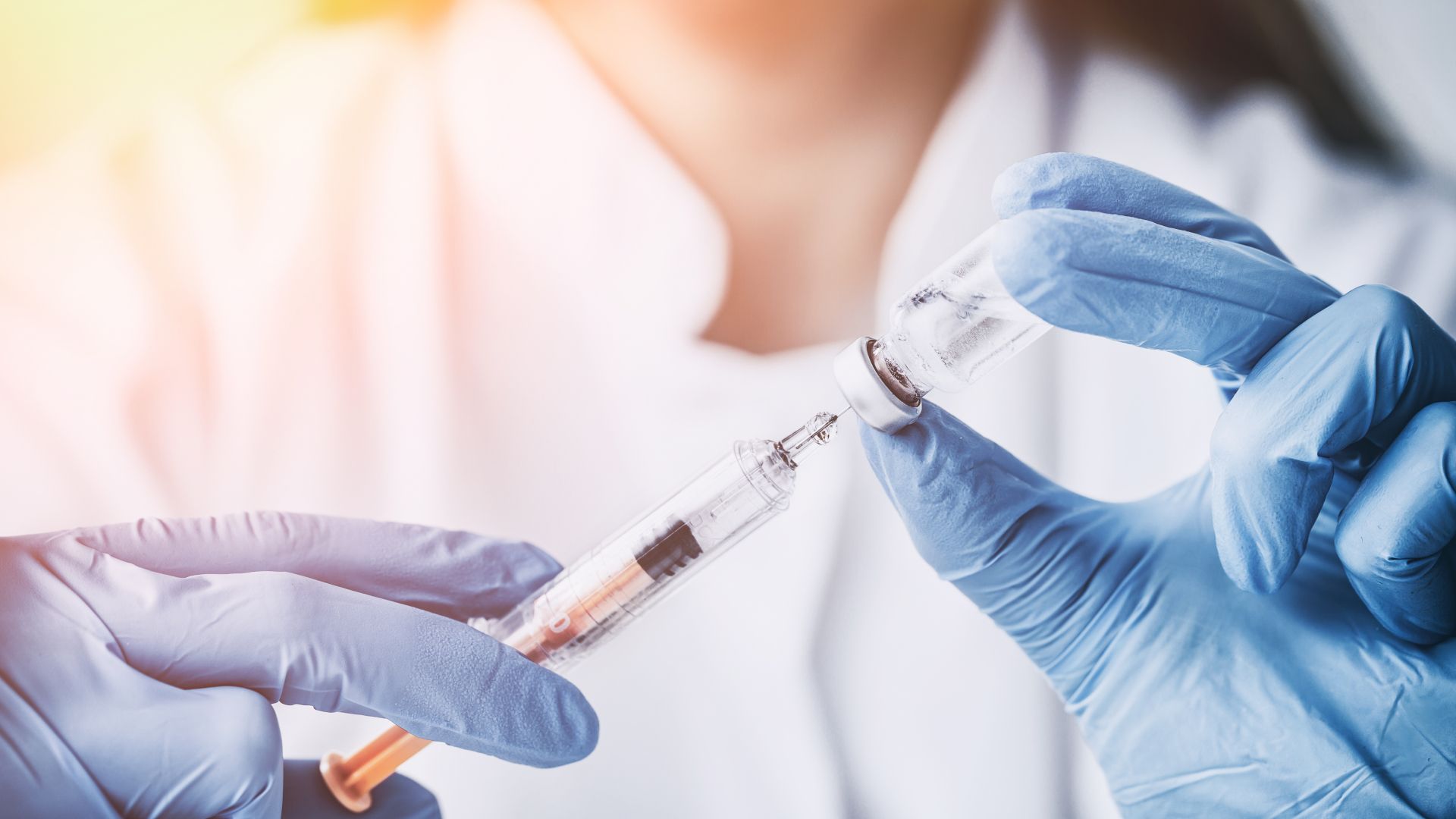 Medic preparing vaccine injection