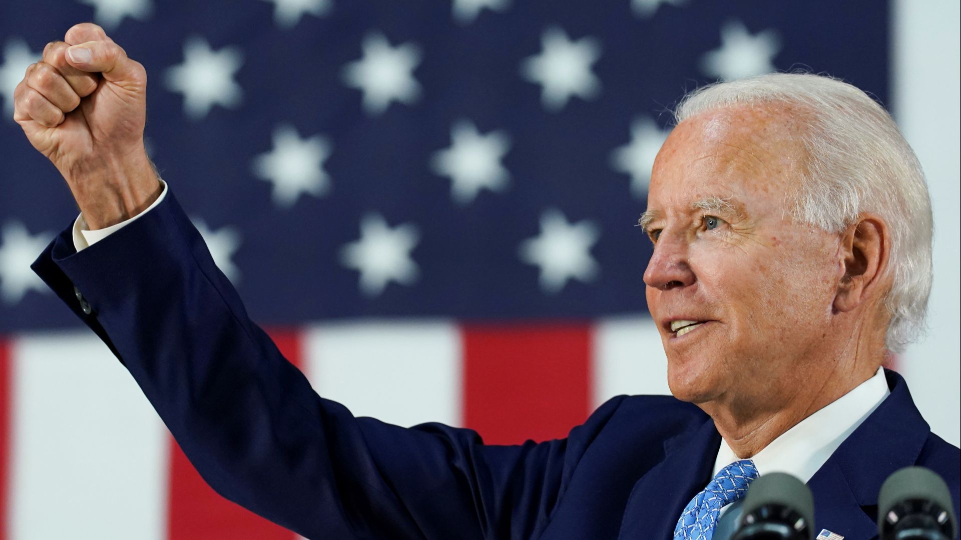 Joe Biden making a speech in front of the stars and stripes