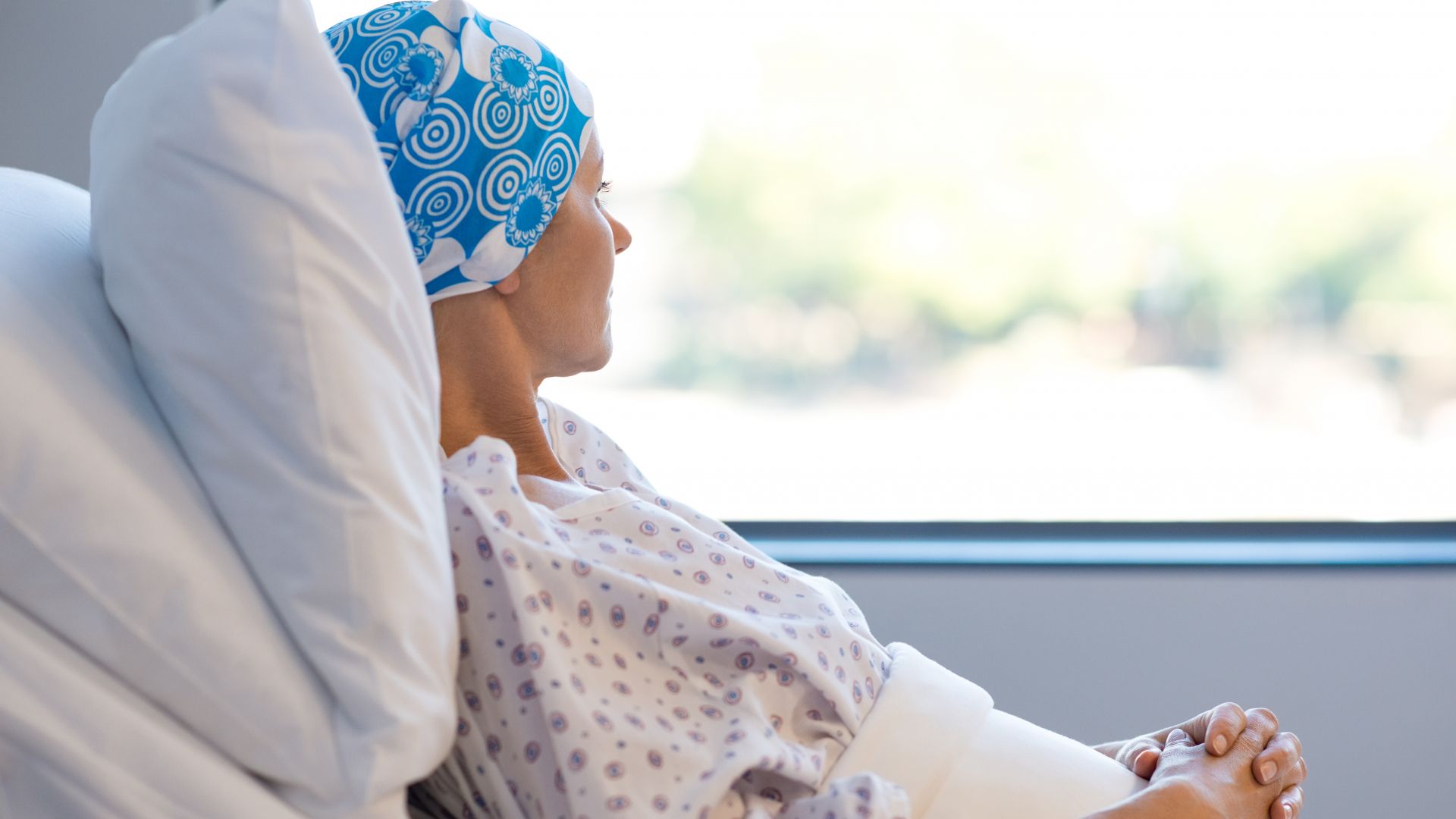 Female cancer patient in a hospital bed