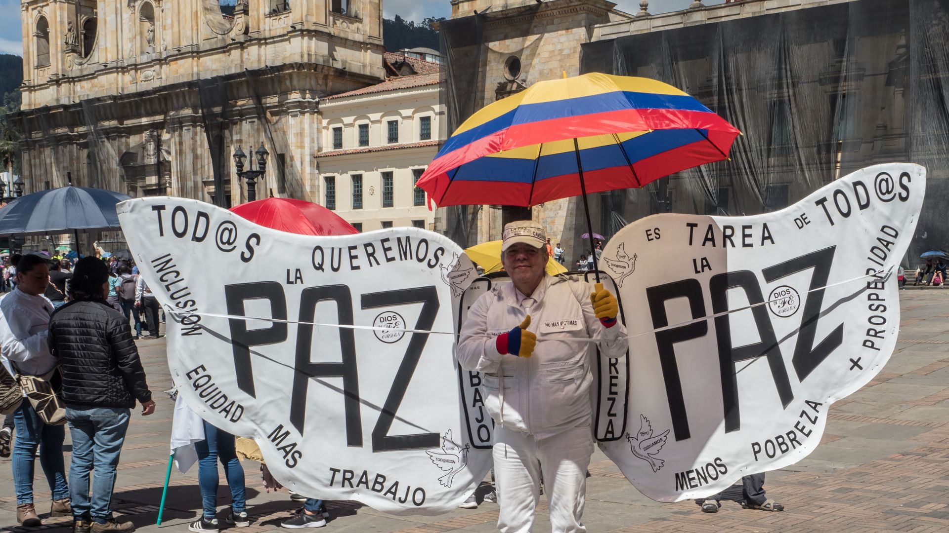 Colombian man dressed as an angel calling for peace, less poverty, more prosperity and work