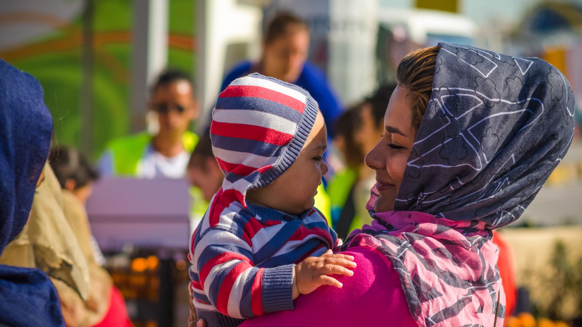 happy asylum refugee migrant mother and children1.jpg