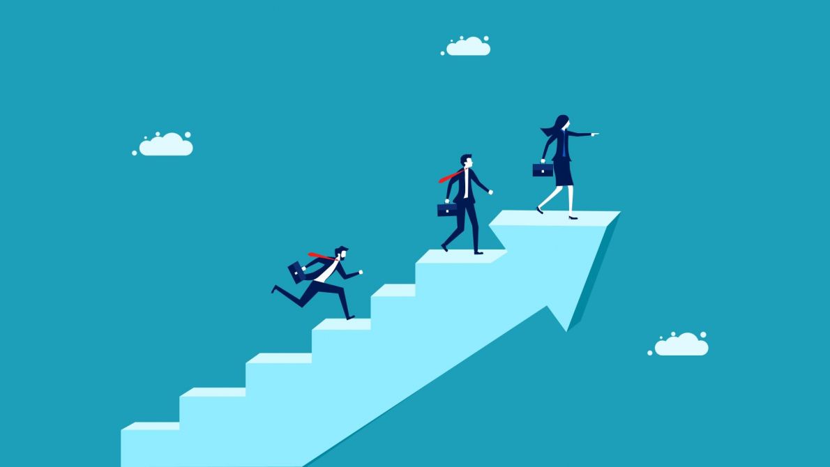 business women and men climbing steps 