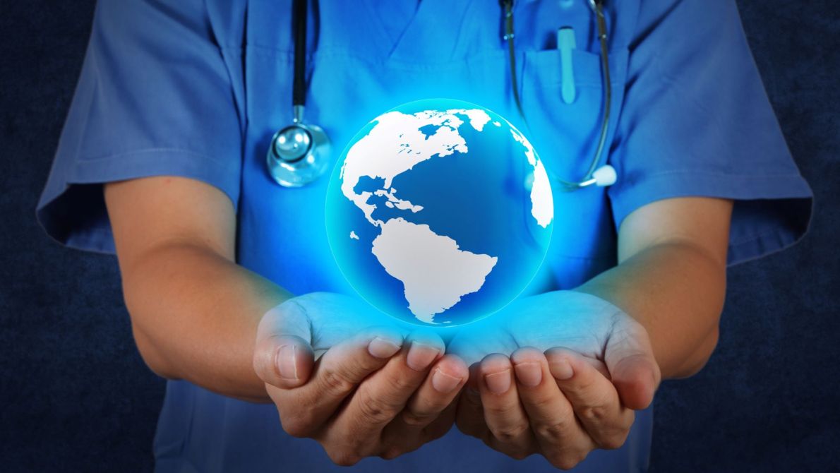 doctor with 3D globe in hands