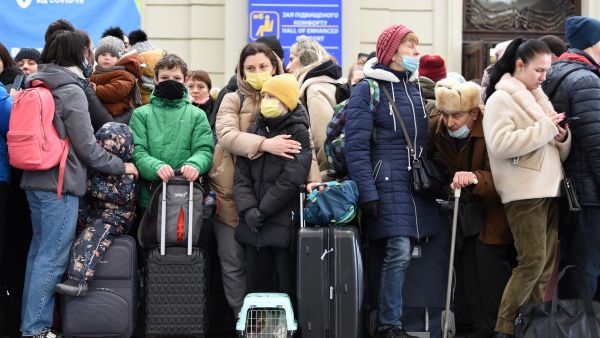 Refugees wait for a train to Poland at Lviv in Ukraine, following the invasion by Russia in February 2022