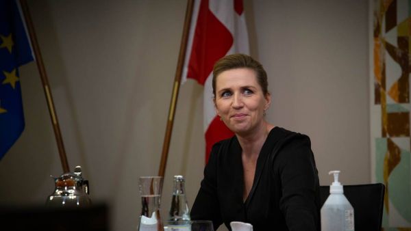 Mette Frederiksen seated at a European Council