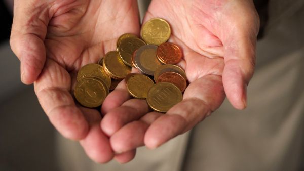 indebtedness for EU consumers euro coins hands