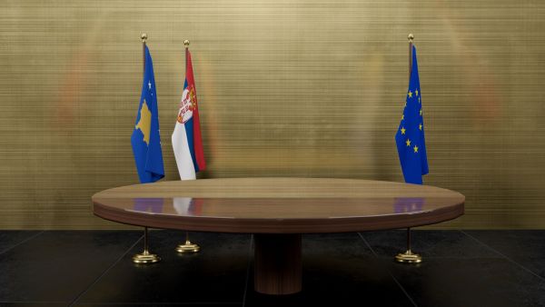 Serbia Kosovo EU flags at negotiation table