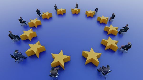 eu ethics body people around eu stars on flag