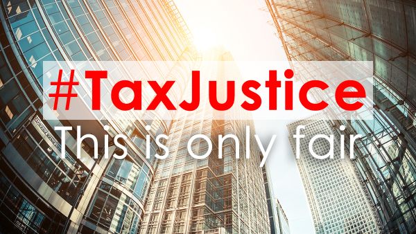 #TAX JUSTICE in front of large company buildings