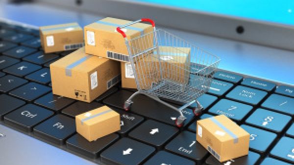 Shopping trolley on keyboaed with parcels for the EU post service