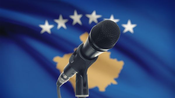 Elections Kosovo - flag and microphone