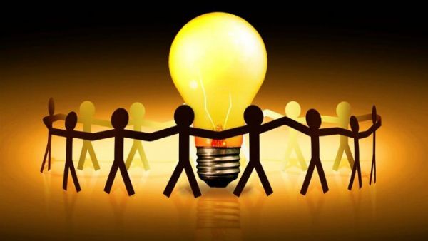 S&Ds propose measures to avoid electricity shortages and crises Cut out paper people holding hands round a light bulb