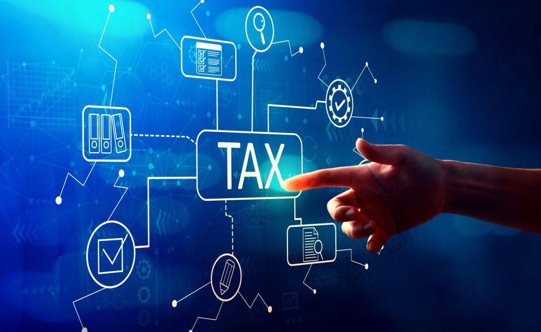 Image of hand pointing at screen that says tax