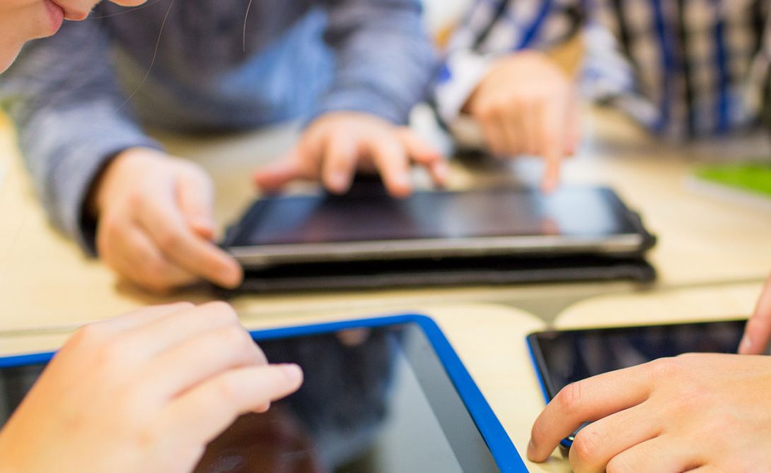 Image of kids learning from Ipad